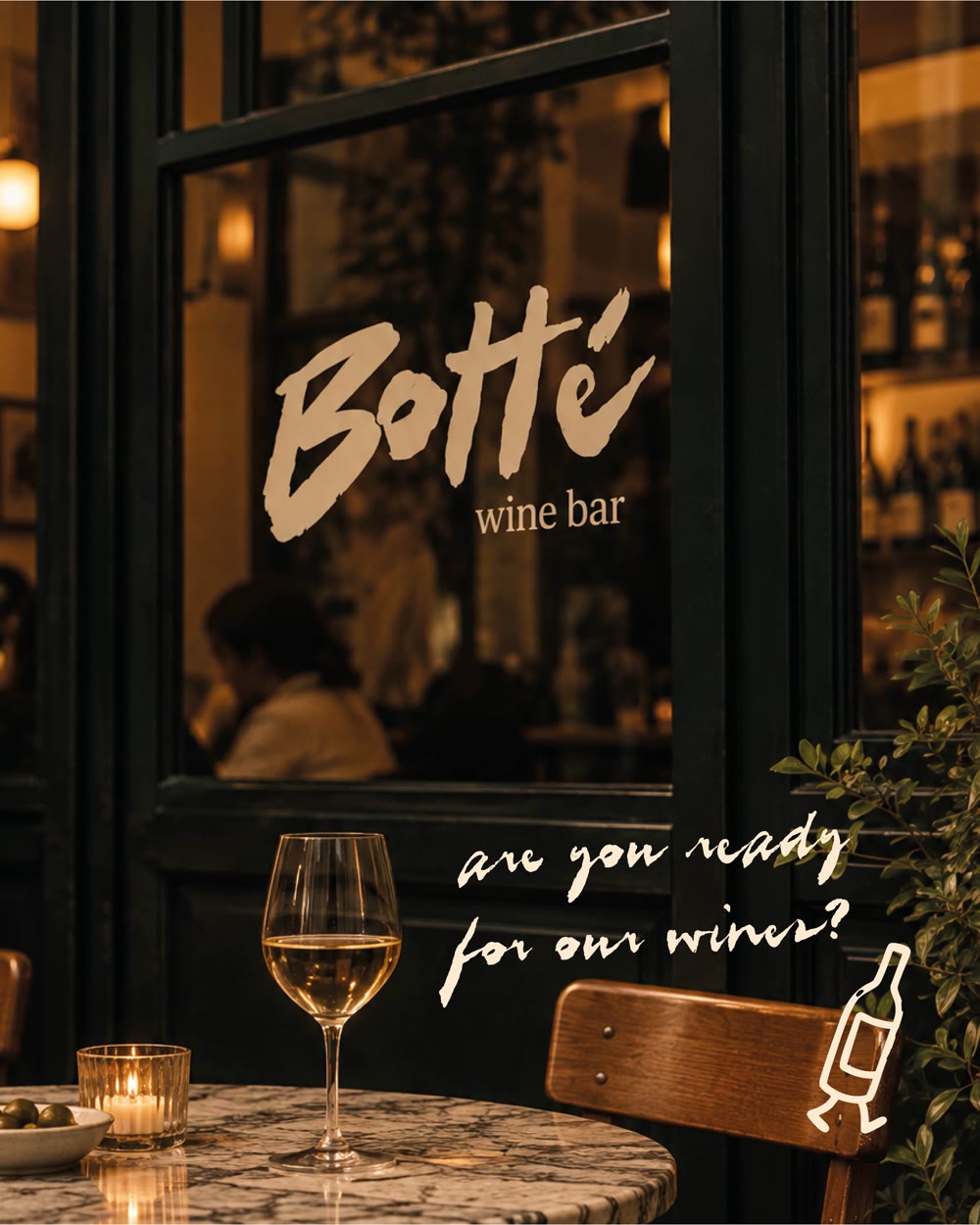 Het raam van Botté wine bar met een glas witte wijn